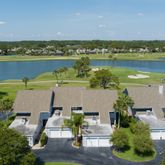 an aerial view of a house with a lake view