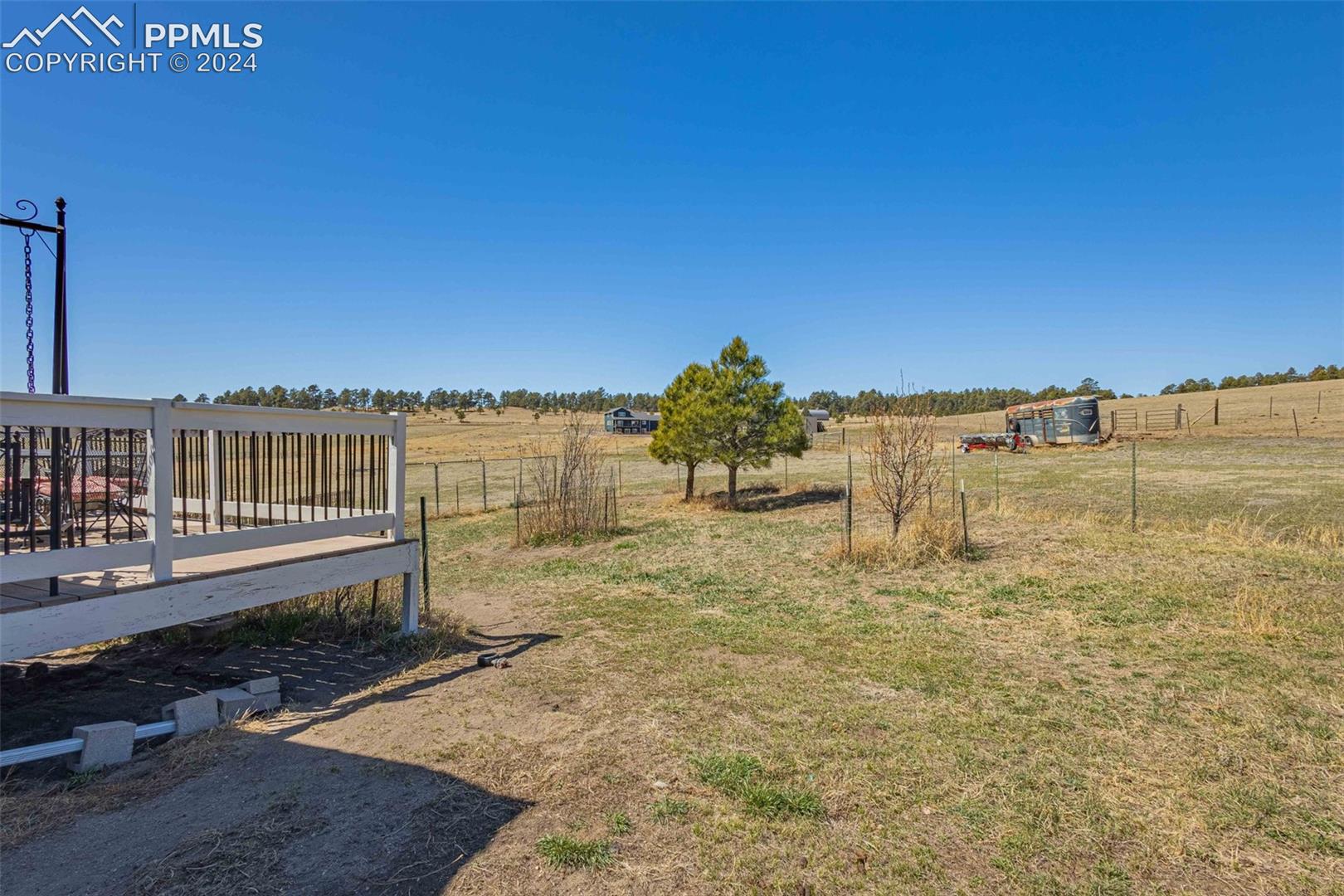 17650 Fremont Fort Road Peyton, CO 80831 - Photo 31 of 41 View of yard with a rural view and a deck