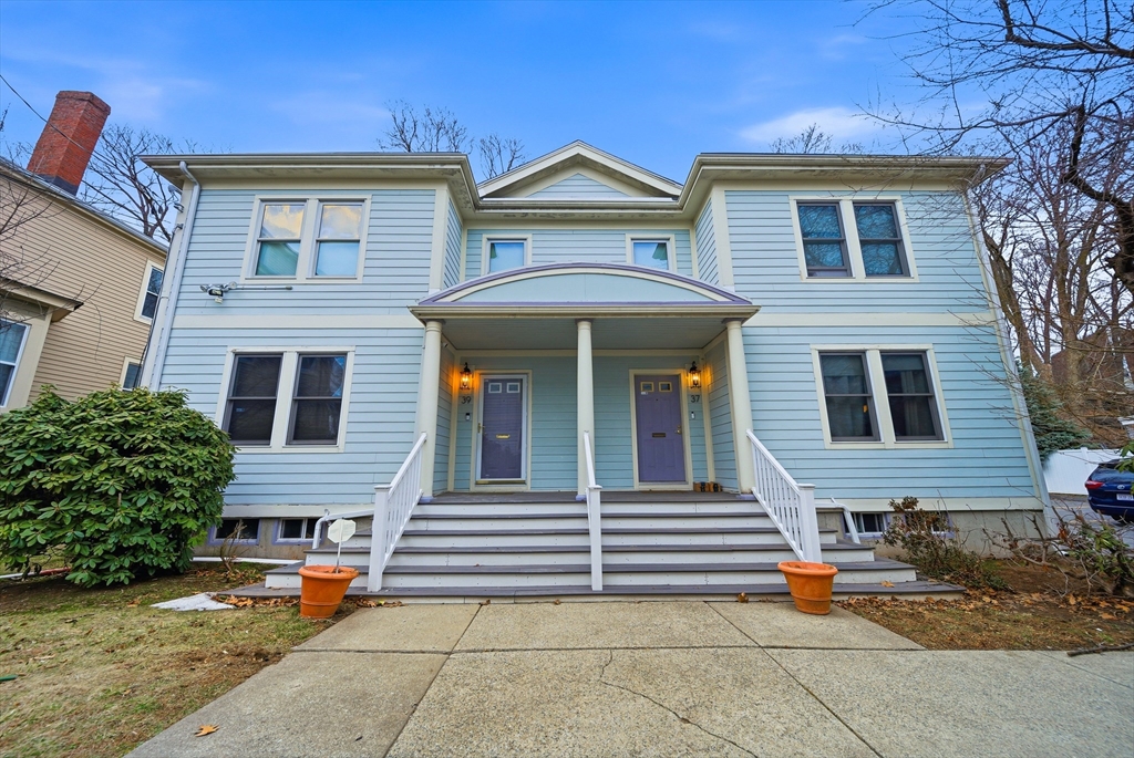 39 Hawthorne Street, Unit 39 Boston, MA 02119 - Photo 1 of 33 a front view of a house with a garage