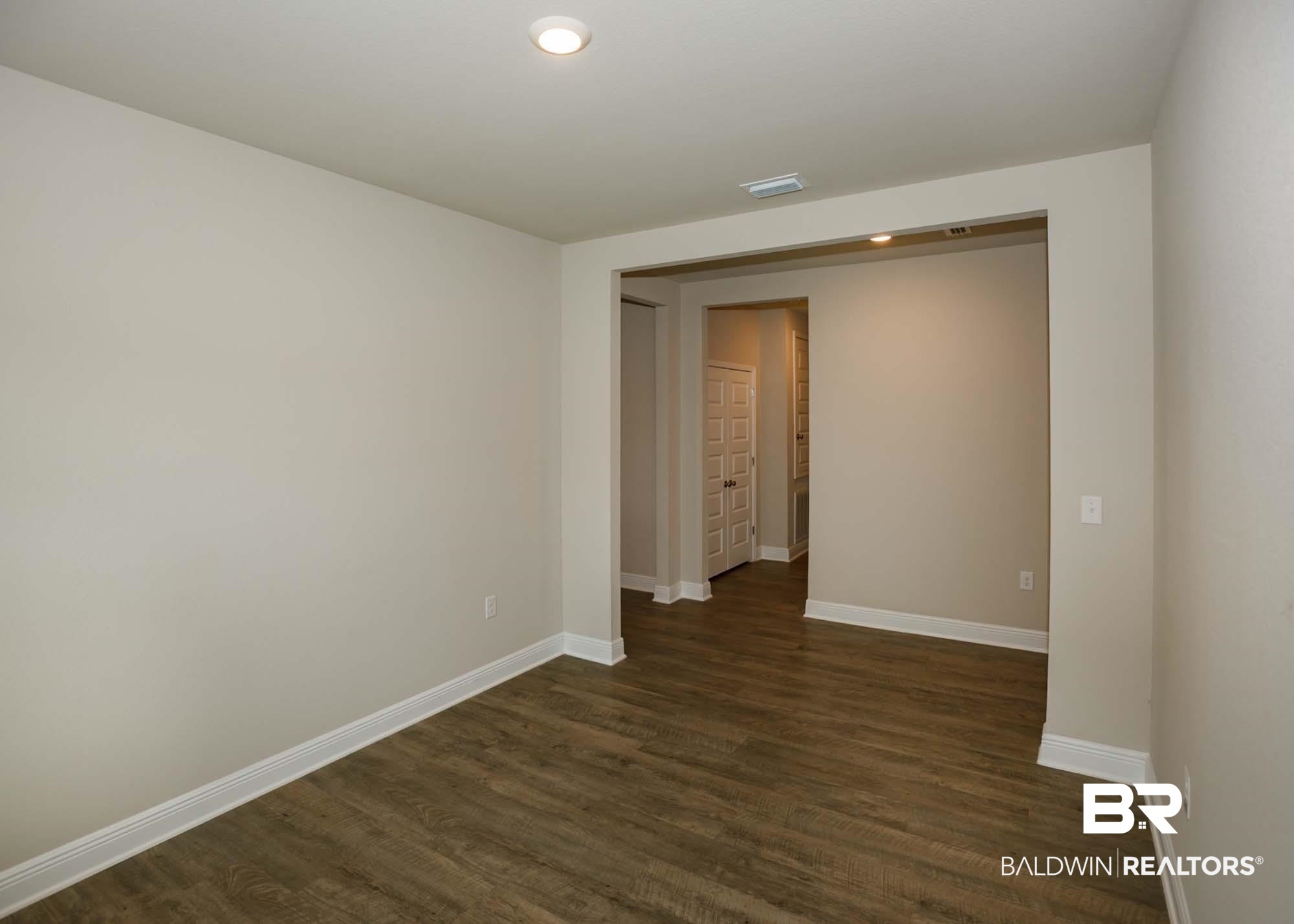 1436 Kairos Loop Foley, AL 36535 - Photo 15 of 52 Unfurnished room with dark wood-type flooring and recessed lighting