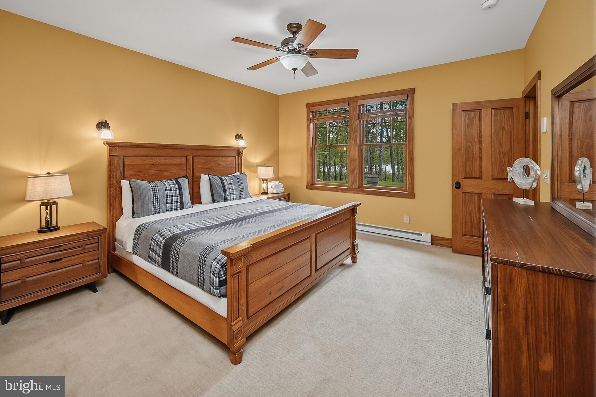 185 Ruta Lane Swanton, MD 21561 - Photo 53 of 81 a bed sitting in a spacious bedroom next to a window