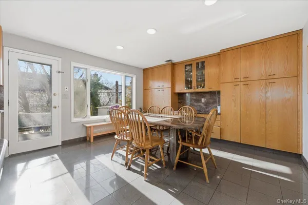 a view of a dining room with furniture window and outside view