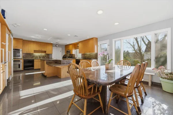 a view of a dining room with furniture window and outside view