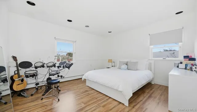 a bedroom with a bed and a dresser