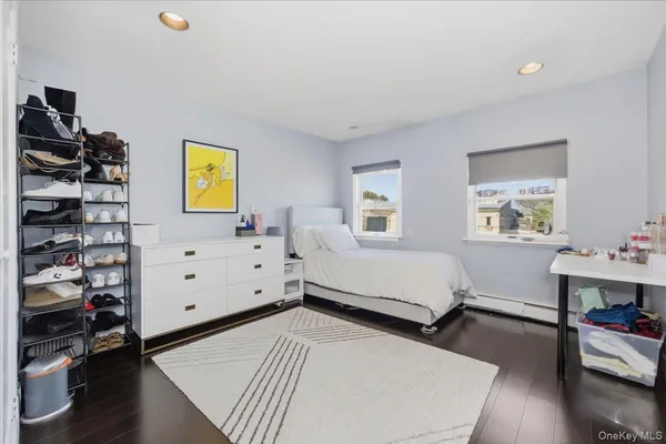 a bedroom with a bed and a chair