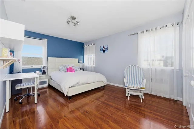 a bedroom with two beds and painted walls