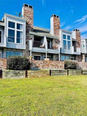 a swimming pool view with a outdoor seating space