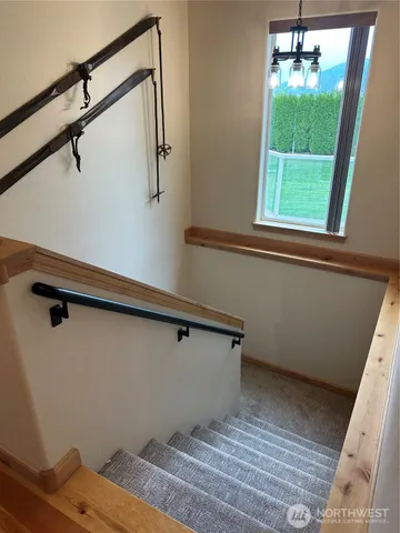 a view of a room with toys and stairs
