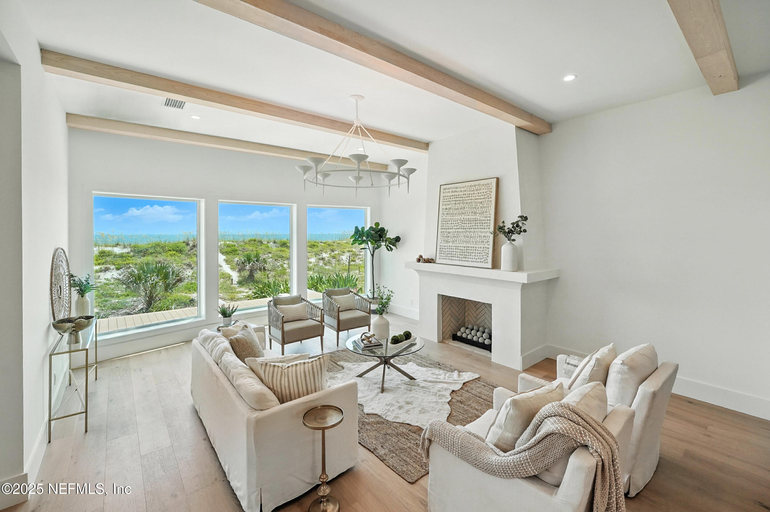1509 Ocean Front Neptune Beach, FL 32266 - Photo 15 of 93 a living room with furniture a fireplace and a large window