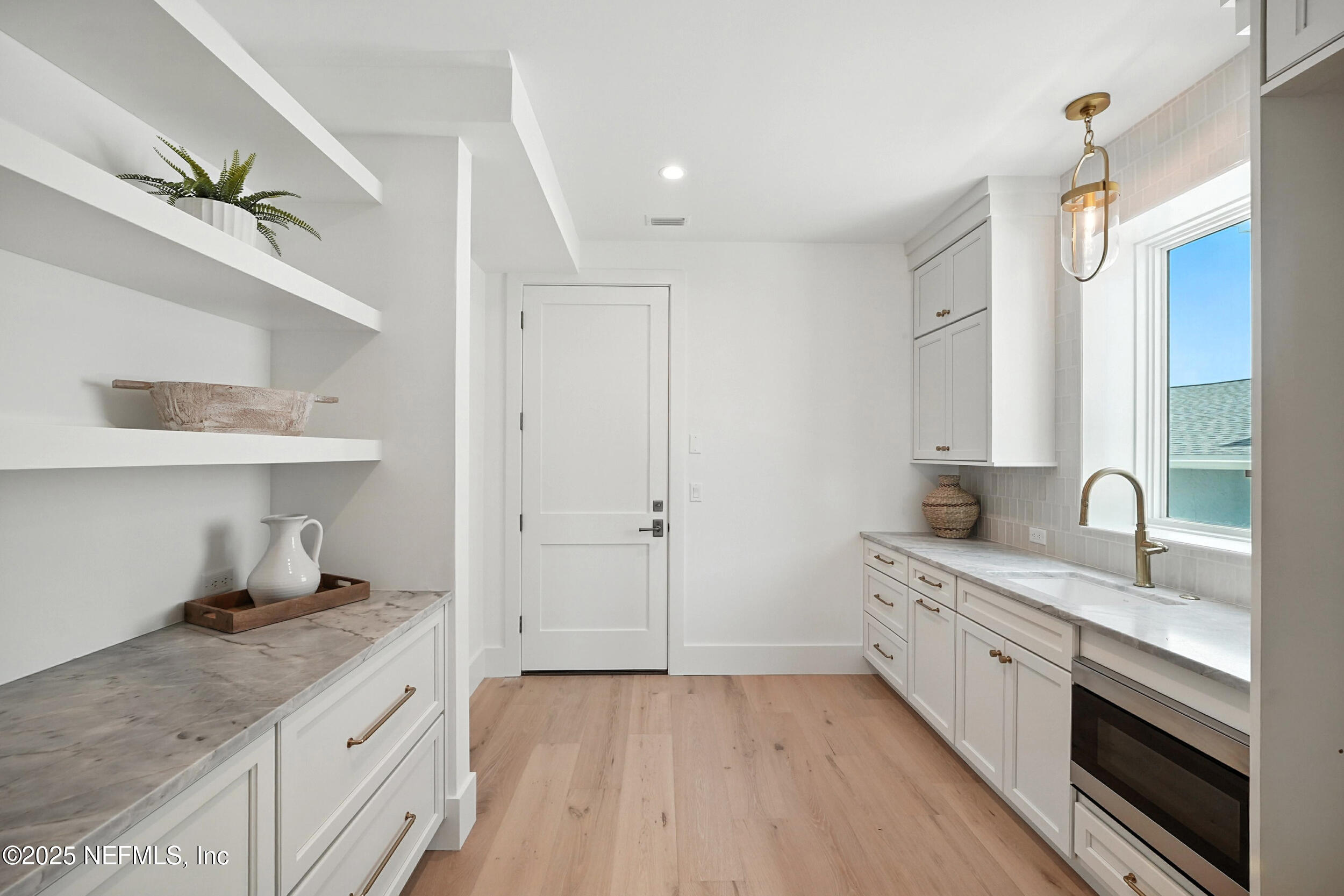 1509 Ocean Front Neptune Beach, FL 32266 - Photo 21 of 93 a kitchen with a sink a stove and cabinets