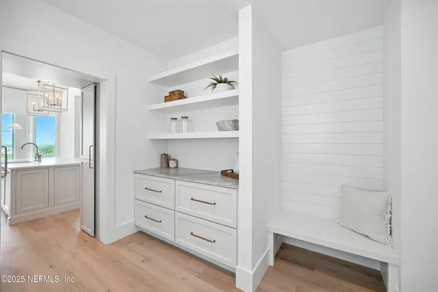 a bathroom with a granite countertop sink a toilet and shower