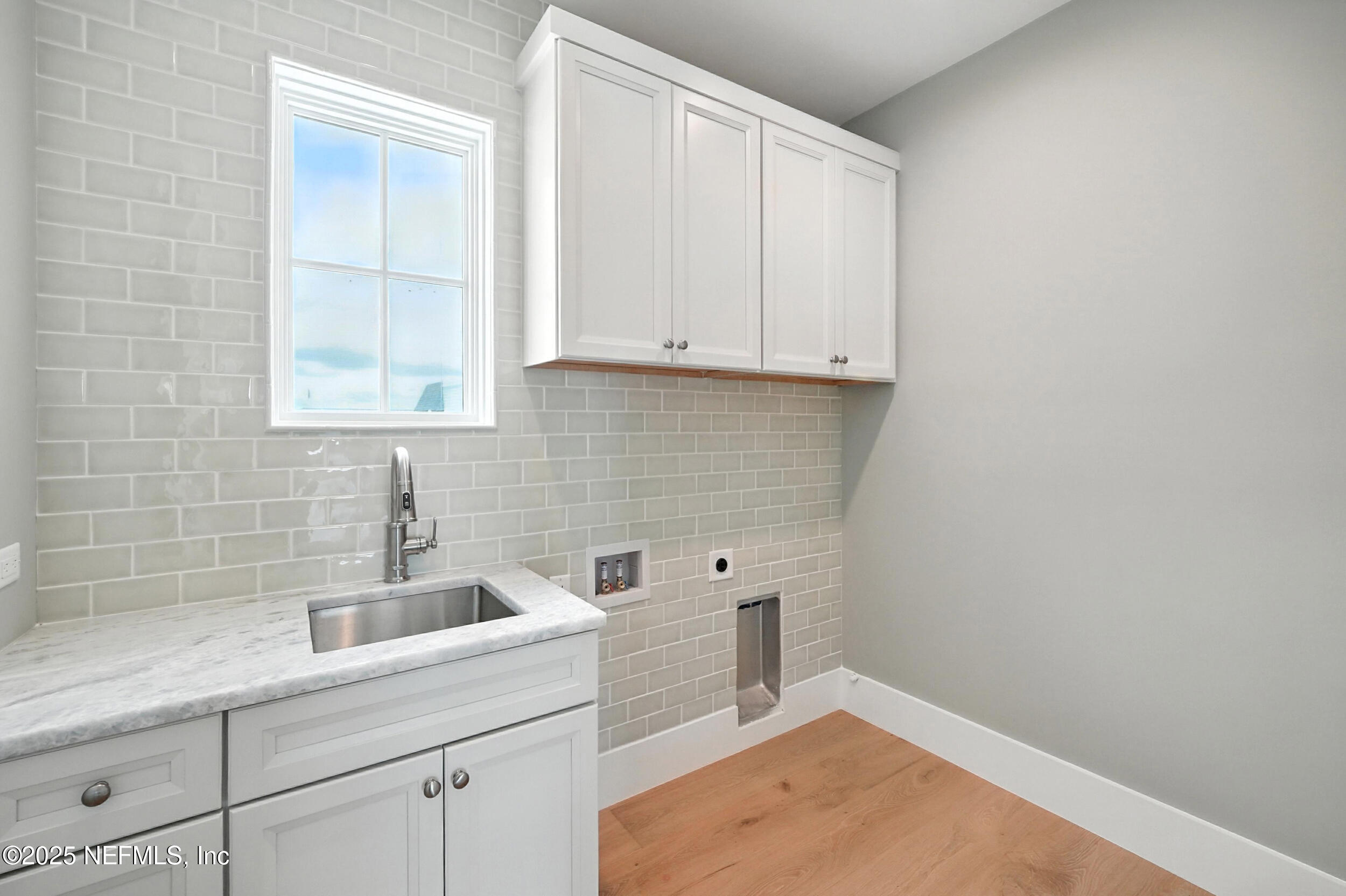 1509 Ocean Front Neptune Beach, FL 32266 - Photo 50 of 93 a view of a bathroom with sink and cabinets
