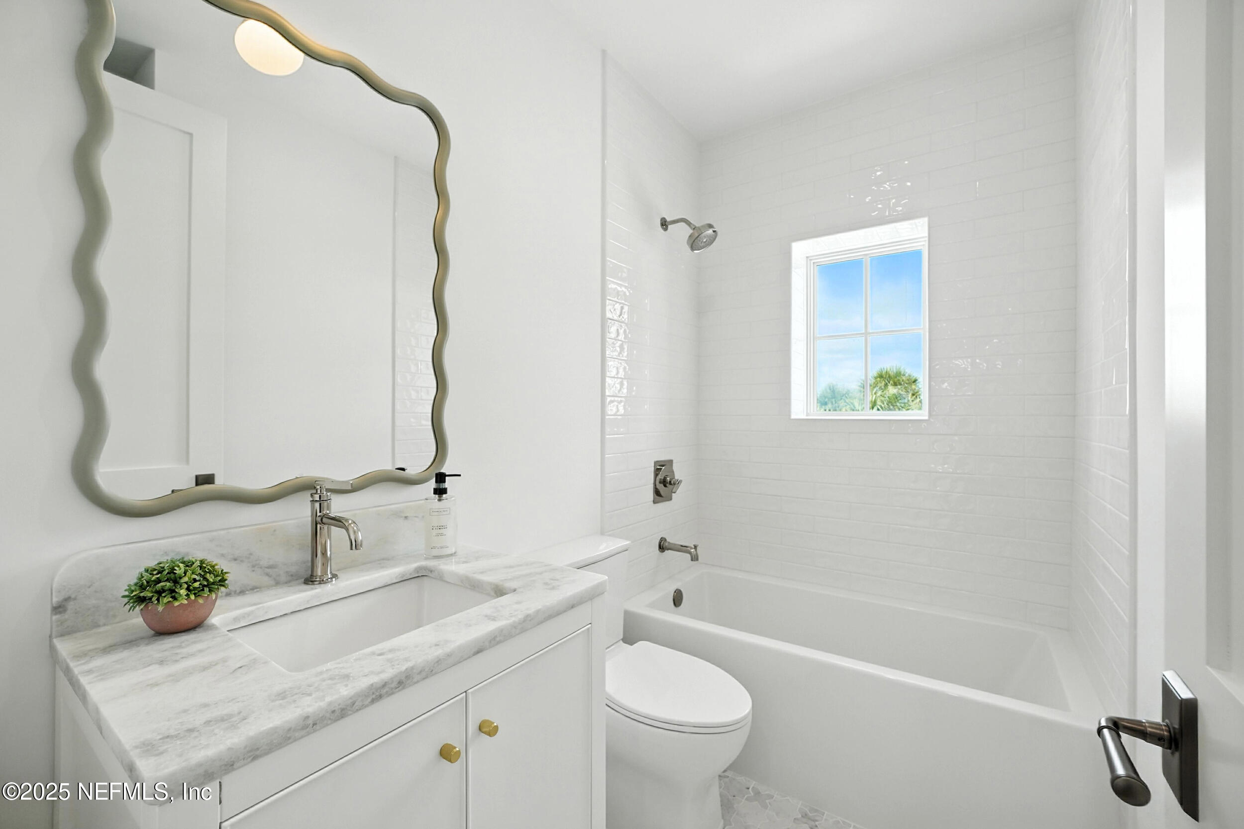 1509 Ocean Front Neptune Beach, FL 32266 - Photo 52 of 93 a bathroom with a granite countertop sink a toilet and shower