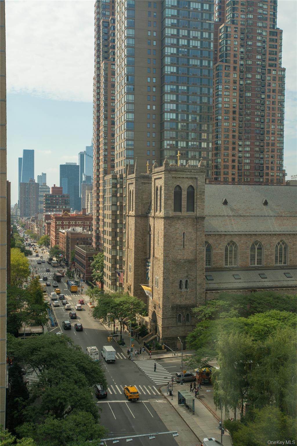 43 West 61st Street, Unit 12F Manhattan, NY 10023 - Photo 13 of 14 a view of a brick building next to a yard