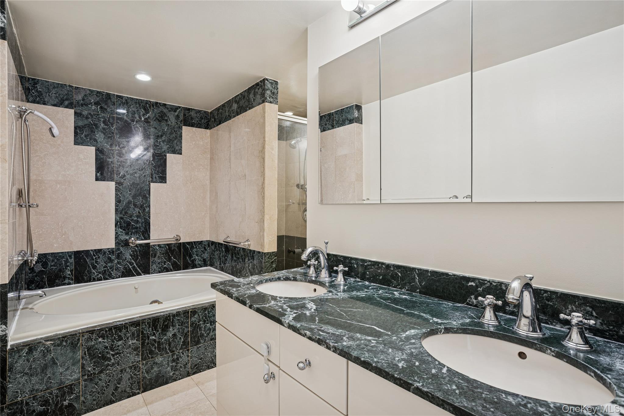 43 West 61st Street, Unit 12F Manhattan, NY 10023 - Photo 6 of 14 a bathroom with a granite countertop sink and a mirror