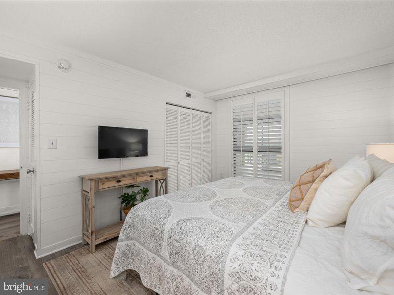 409 Annapolis House Road, Unit 409N Bethany Beach, DE 19930 - Photo 21 of 75 a bedroom with a bed and a flat screen tv