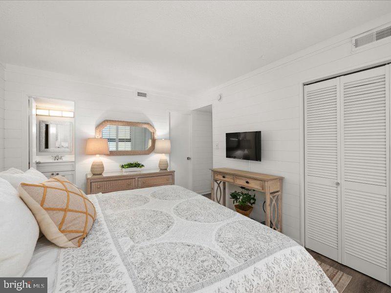 409 Annapolis House Road, Unit 409N Bethany Beach, DE 19930 - Photo 24 of 75 a bedroom with a bed and a television