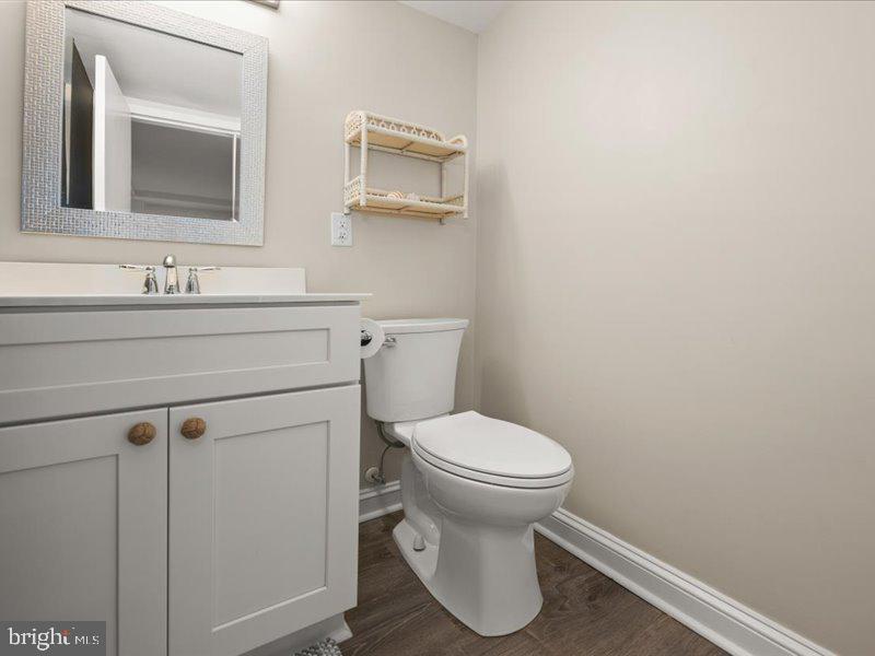 409 Annapolis House Road, Unit 409N Bethany Beach, DE 19930 - Photo 26 of 75 a bathroom with a sink toilet and mirror