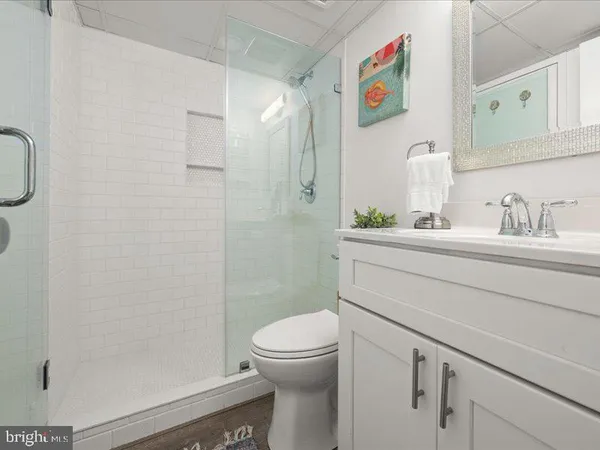 a view of a chair and tables in the patio with a barbeque grill