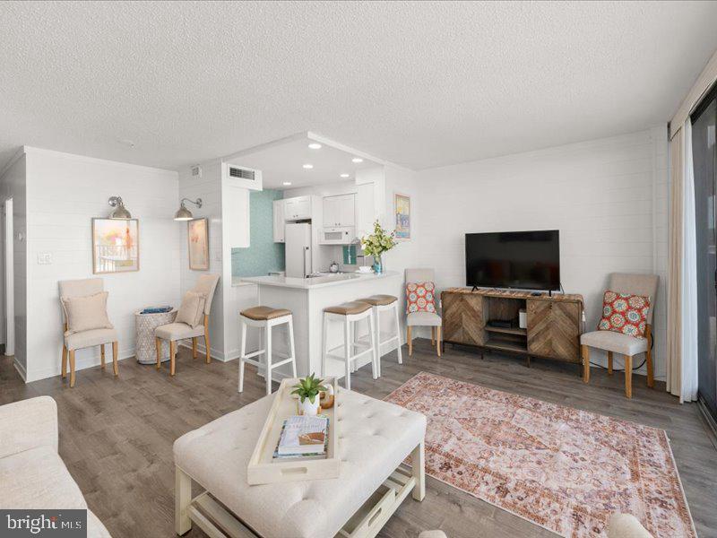 409 Annapolis House Road, Unit 409N Bethany Beach, DE 19930 - Photo 8 of 75 a living room with furniture and a flat screen tv