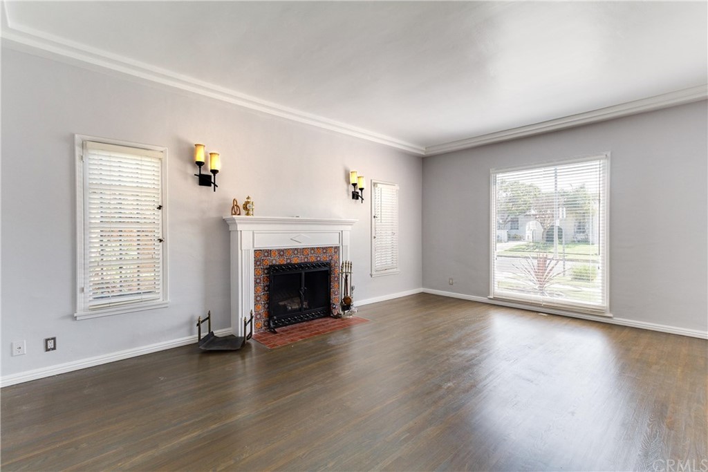1763 Stearns Drive Los Angeles, CA 90035 - Photo 1 of 33 an empty room with wooden floor fireplace and windows