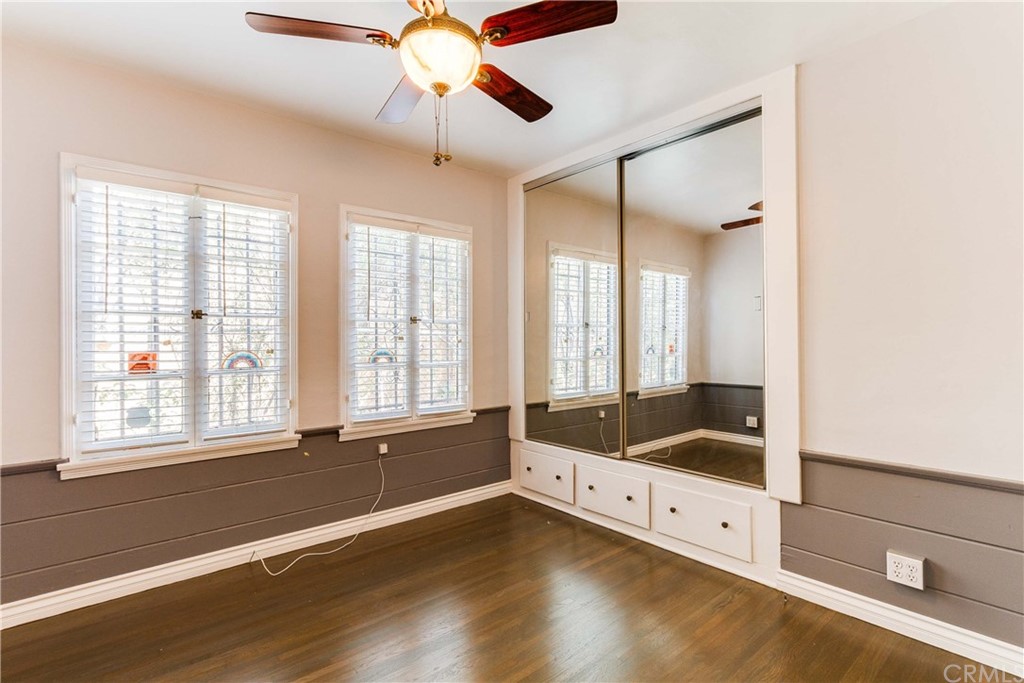 1763 Stearns Drive Los Angeles, CA 90035 - Photo 18 of 33 a view of an empty room with a window and wooden floor