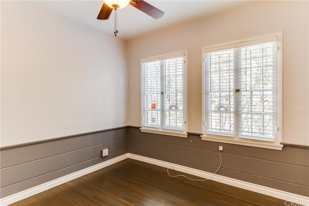 1763 Stearns Drive Los Angeles, CA 90035 - Photo 19 of 33 a view of an empty room with wooden floor and a window