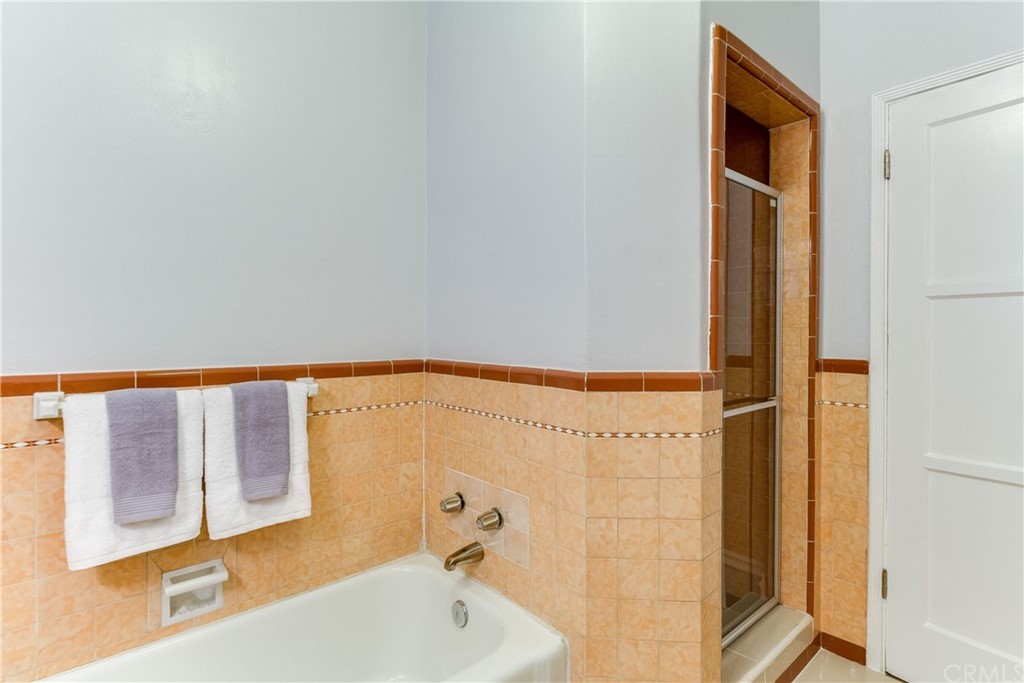 1763 Stearns Drive Los Angeles, CA 90035 - Photo 23 of 33 a bathroom with a bathtub and a shower