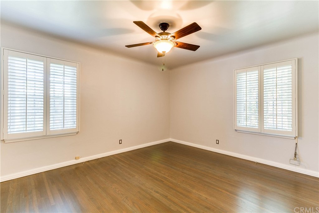 1763 Stearns Drive Los Angeles, CA 90035 - Photo 24 of 33 a view of an empty room with wooden floor and a window