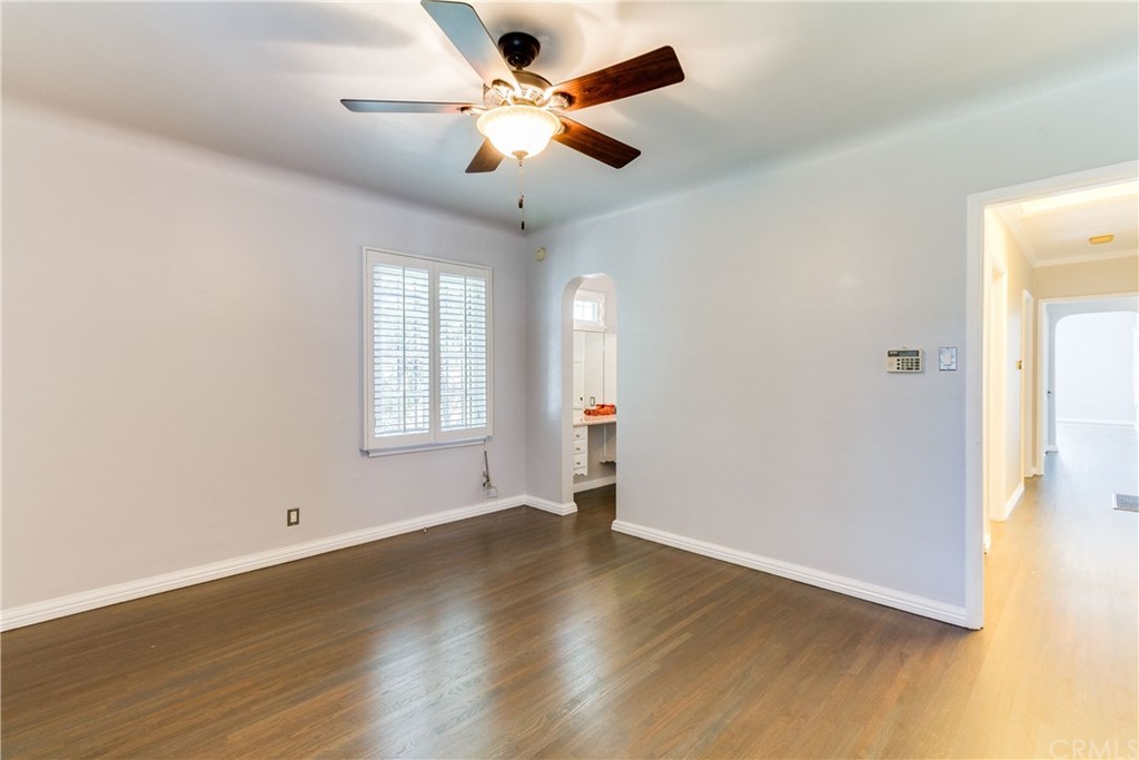 1763 Stearns Drive Los Angeles, CA 90035 - Photo 25 of 33 an empty room with wooden floor and windows