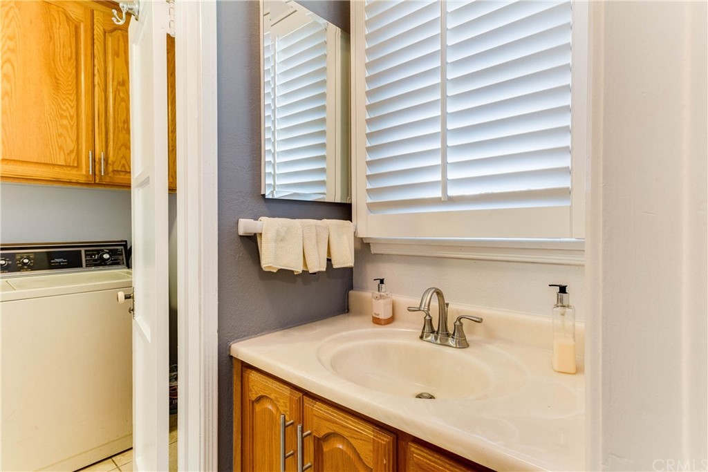 1763 Stearns Drive Los Angeles, CA 90035 - Photo 29 of 33 a bathroom with a sink and a window