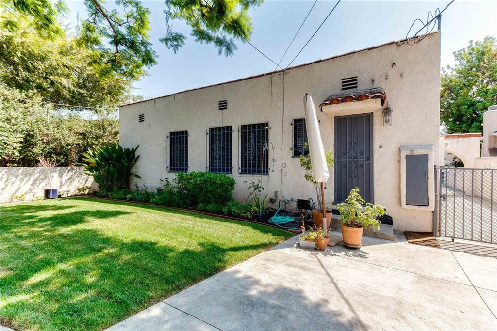 1763 Stearns Drive Los Angeles, CA 90035 - Photo 30 of 33 a front view of a house with garden