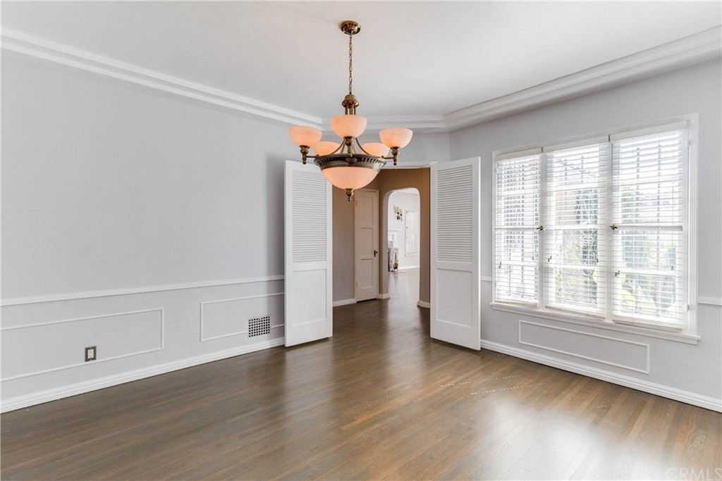 1763 Stearns Drive Los Angeles, CA 90035 - Photo 8 of 33 a view of a room with wooden floor chandelier and windows
