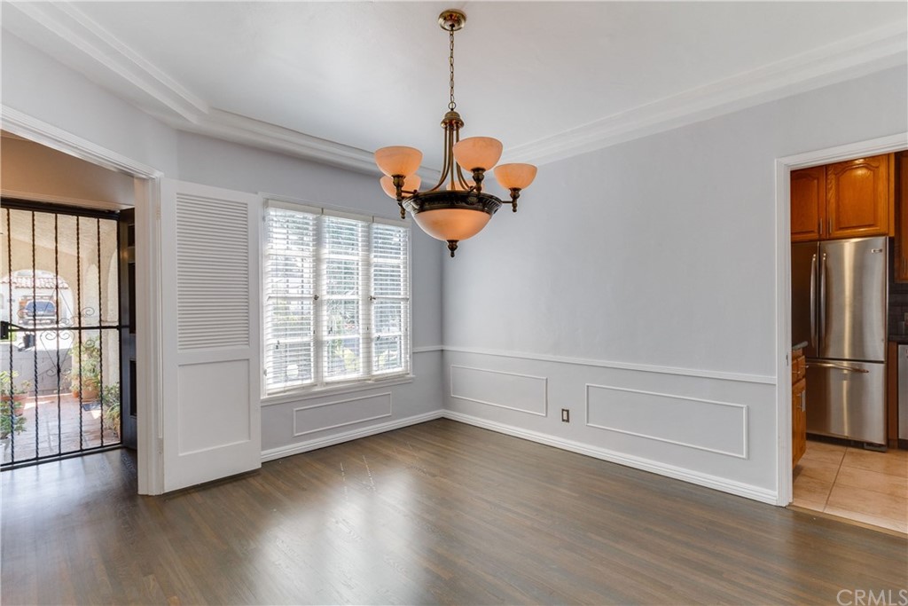 1763 Stearns Drive Los Angeles, CA 90035 - Photo 9 of 33 a view of a room with wooden floor entryway and a window