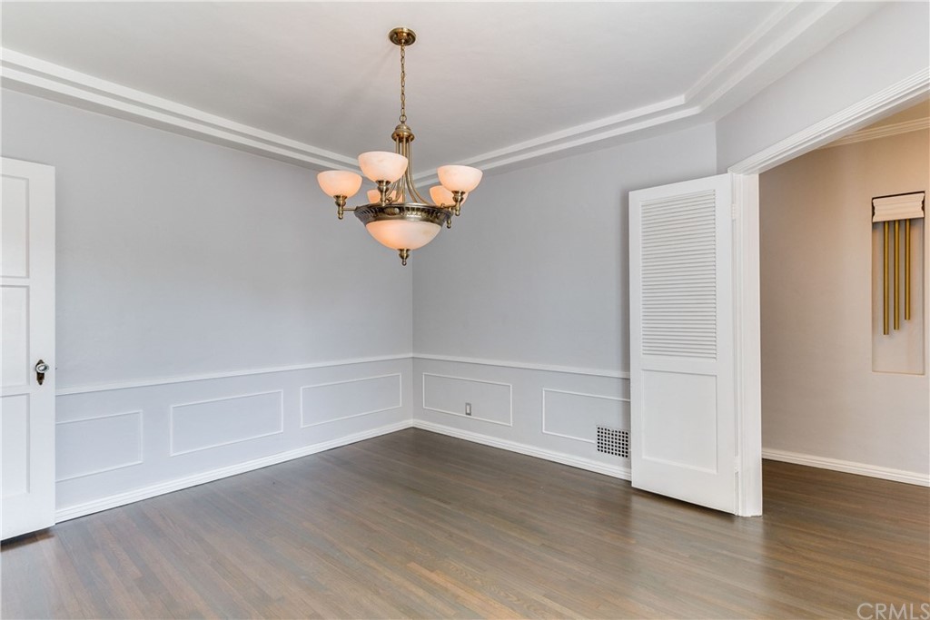 1763 Stearns Drive Los Angeles, CA 90035 - Photo 10 of 33 a view of a room with a chandelier fan and wooden floor