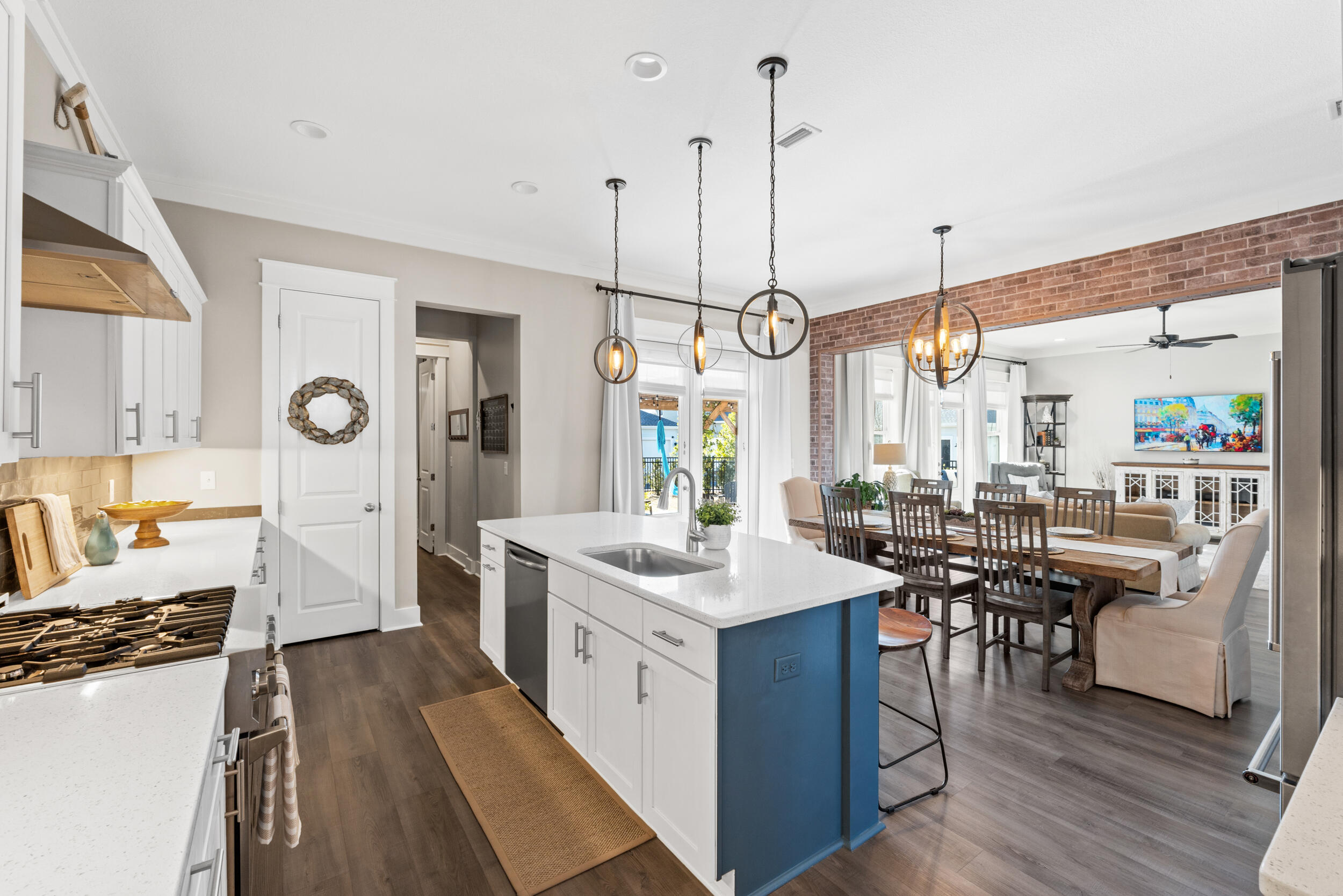 1313 North Discovery Loop Panama City, FL 32405 - Photo 11 of 50 a open kitchen with stainless steel appliances granite countertop a lot of counter space and wooden floors