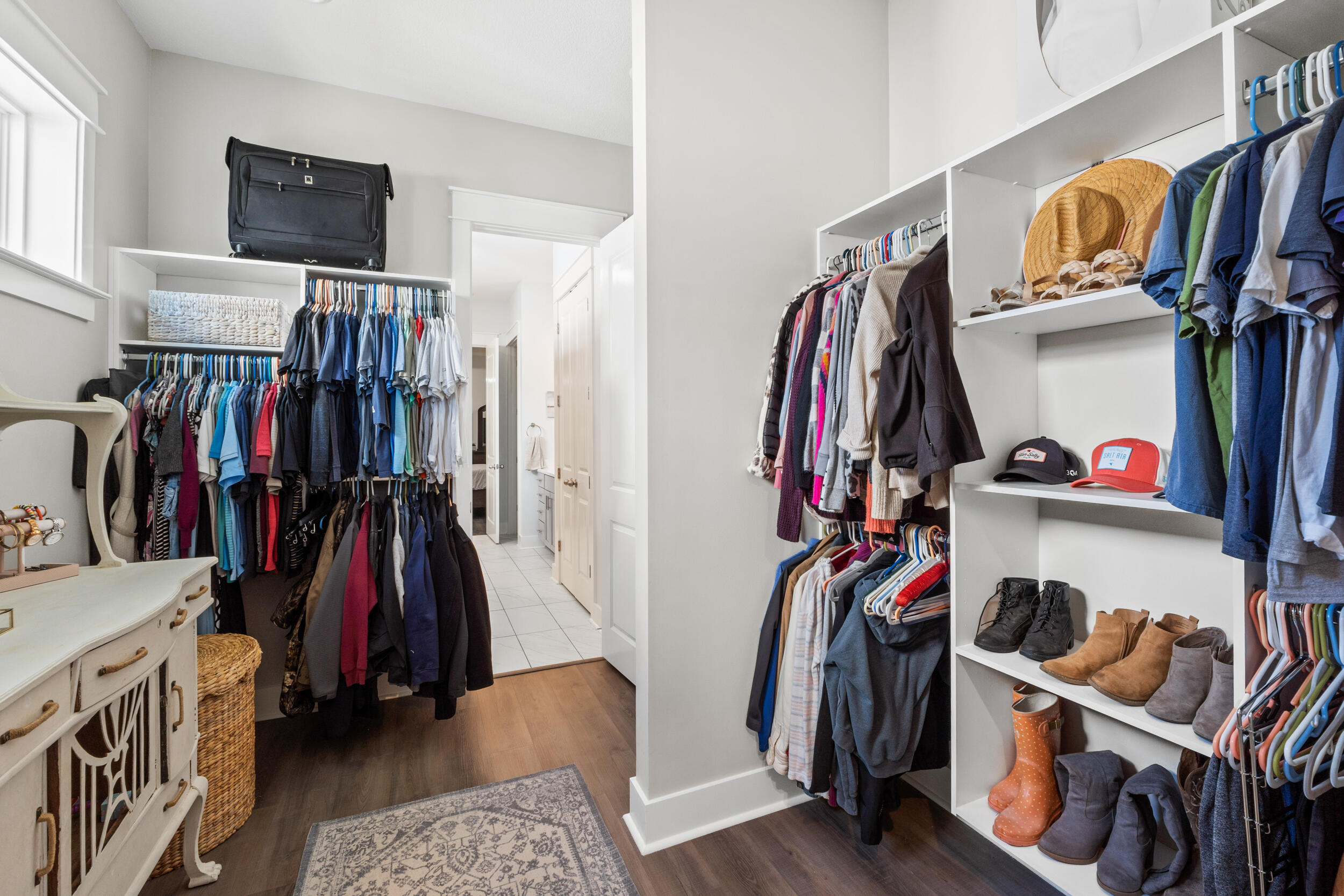 1313 North Discovery Loop Panama City, FL 32405 - Photo 17 of 50 a view of walk in closet with clothes and shoes