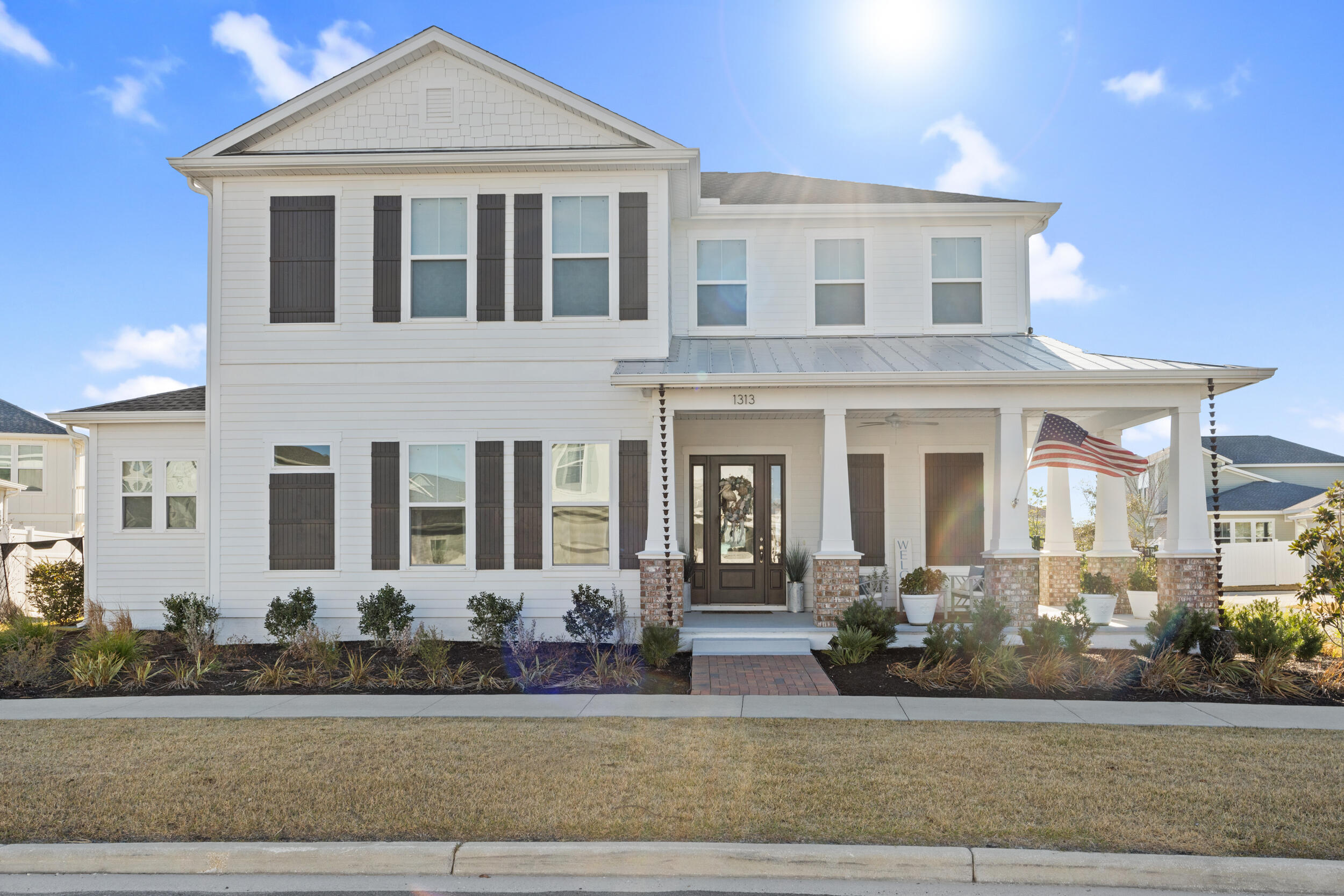 1313 North Discovery Loop Panama City, FL 32405 - Photo 2 of 50 a front view of a house with a yard