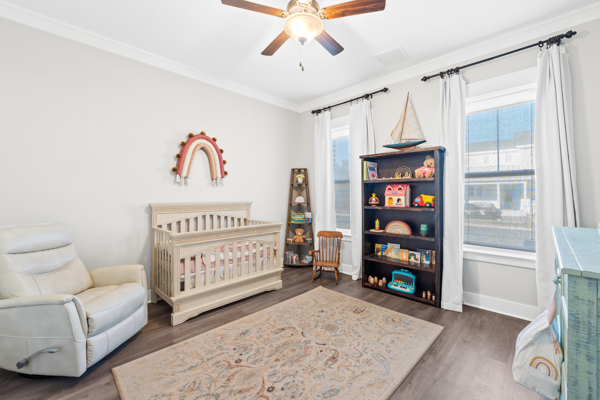 1313 North Discovery Loop Panama City, FL 32405 - Photo 21 of 50 a bedroom with furniture and a book shelf