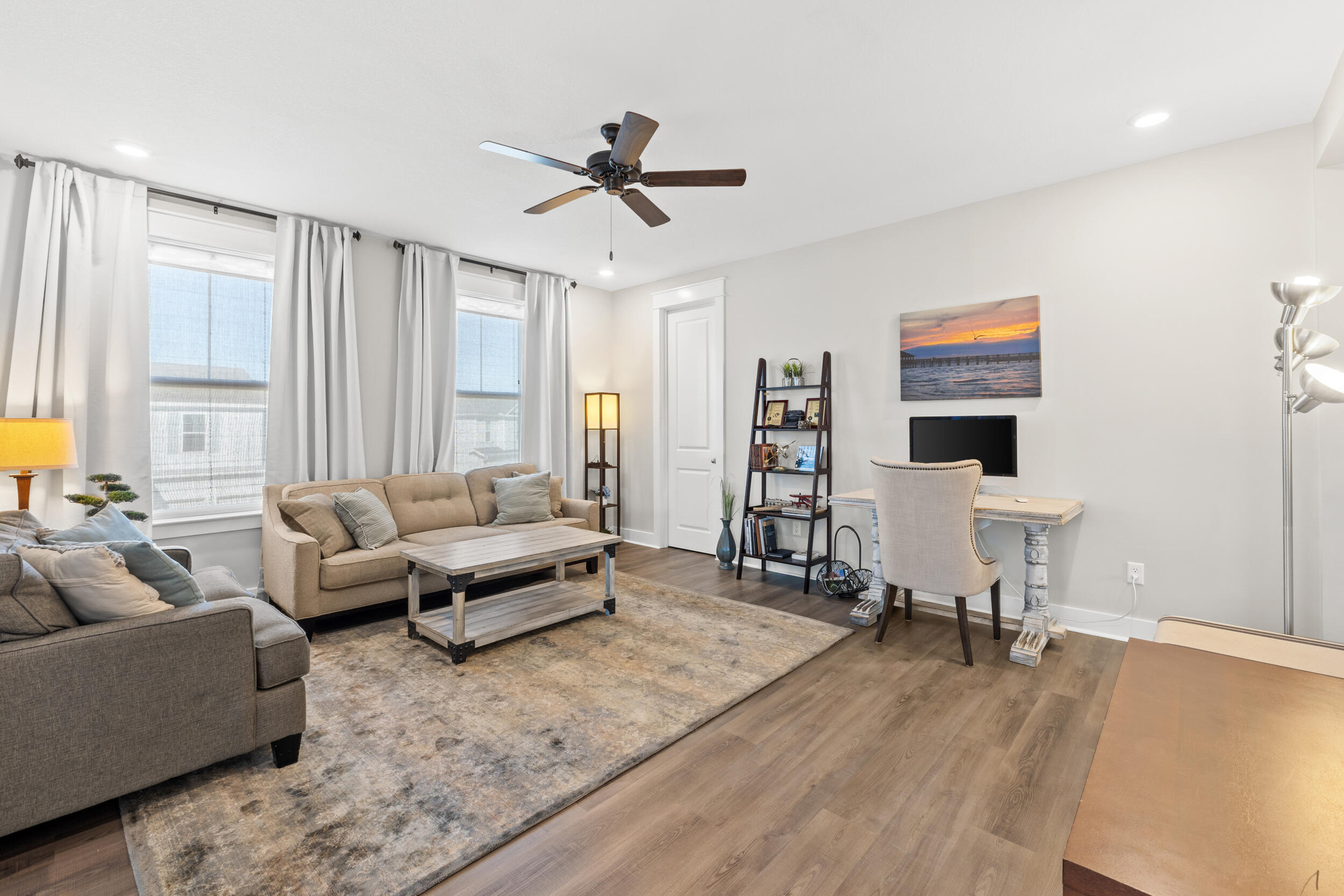 1313 North Discovery Loop Panama City, FL 32405 - Photo 24 of 50 a living room with furniture and a flat screen tv
