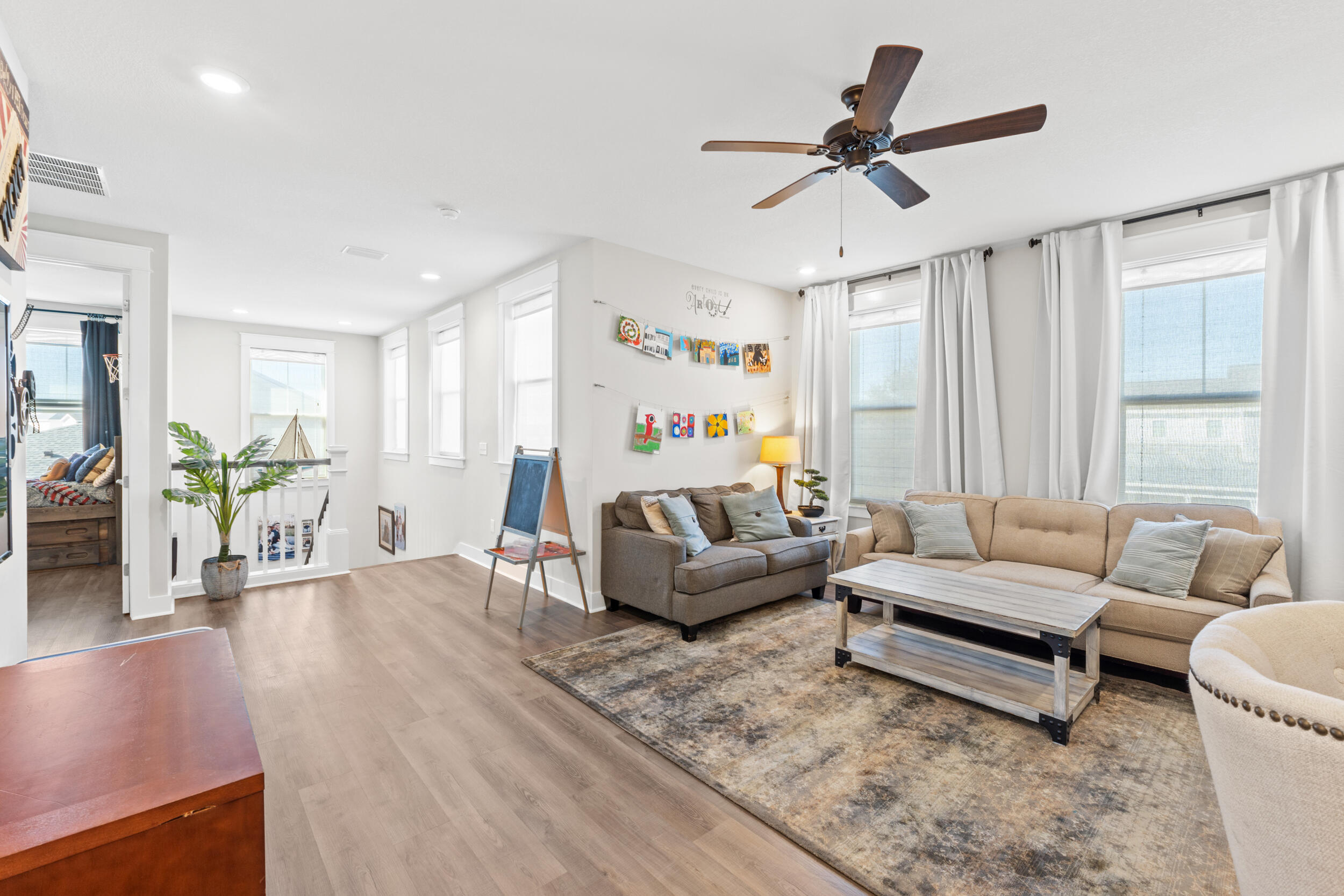 1313 North Discovery Loop Panama City, FL 32405 - Photo 25 of 50 a living room with furniture and a large window