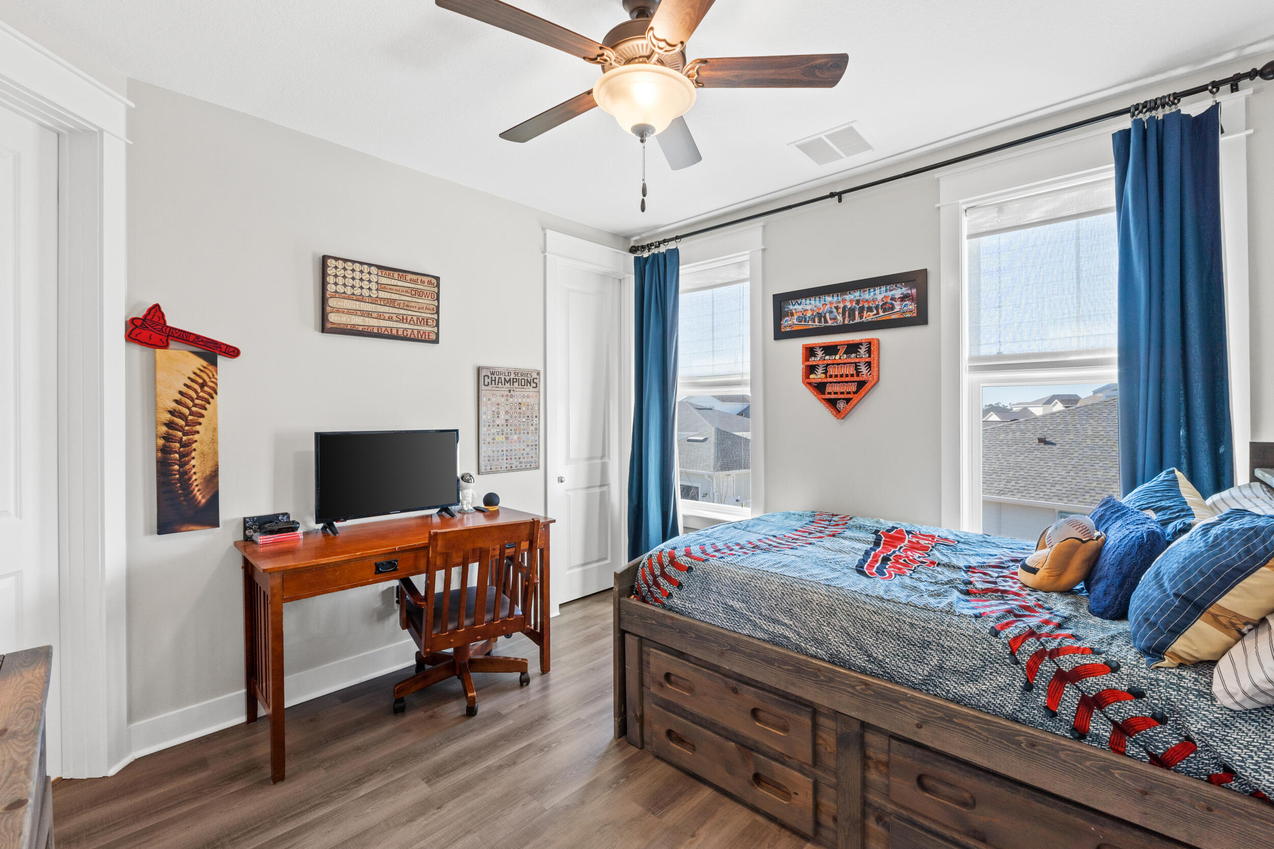 1313 North Discovery Loop Panama City, FL 32405 - Photo 26 of 50 a bedroom with a bed and a chandelier