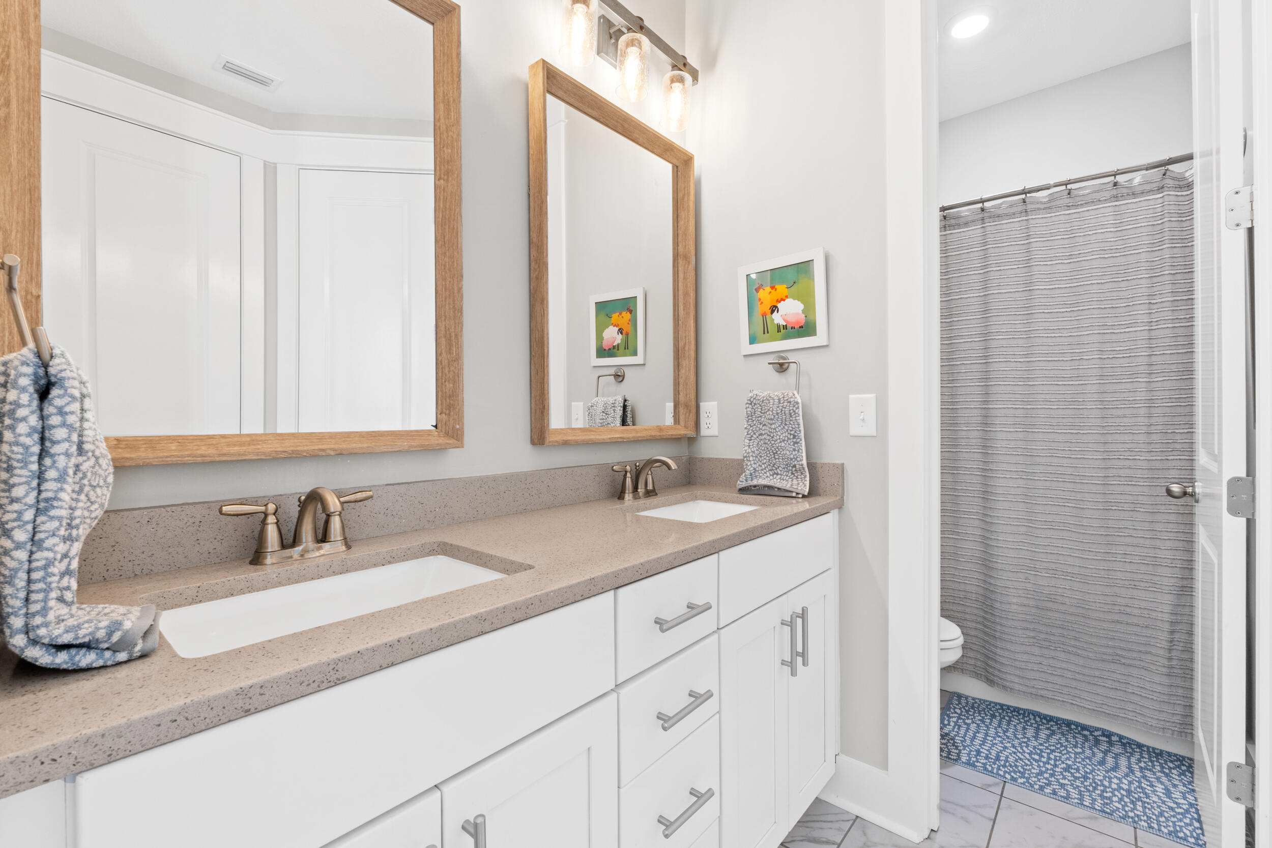 1313 North Discovery Loop Panama City, FL 32405 - Photo 28 of 50 a bathroom with a sink and a mirror