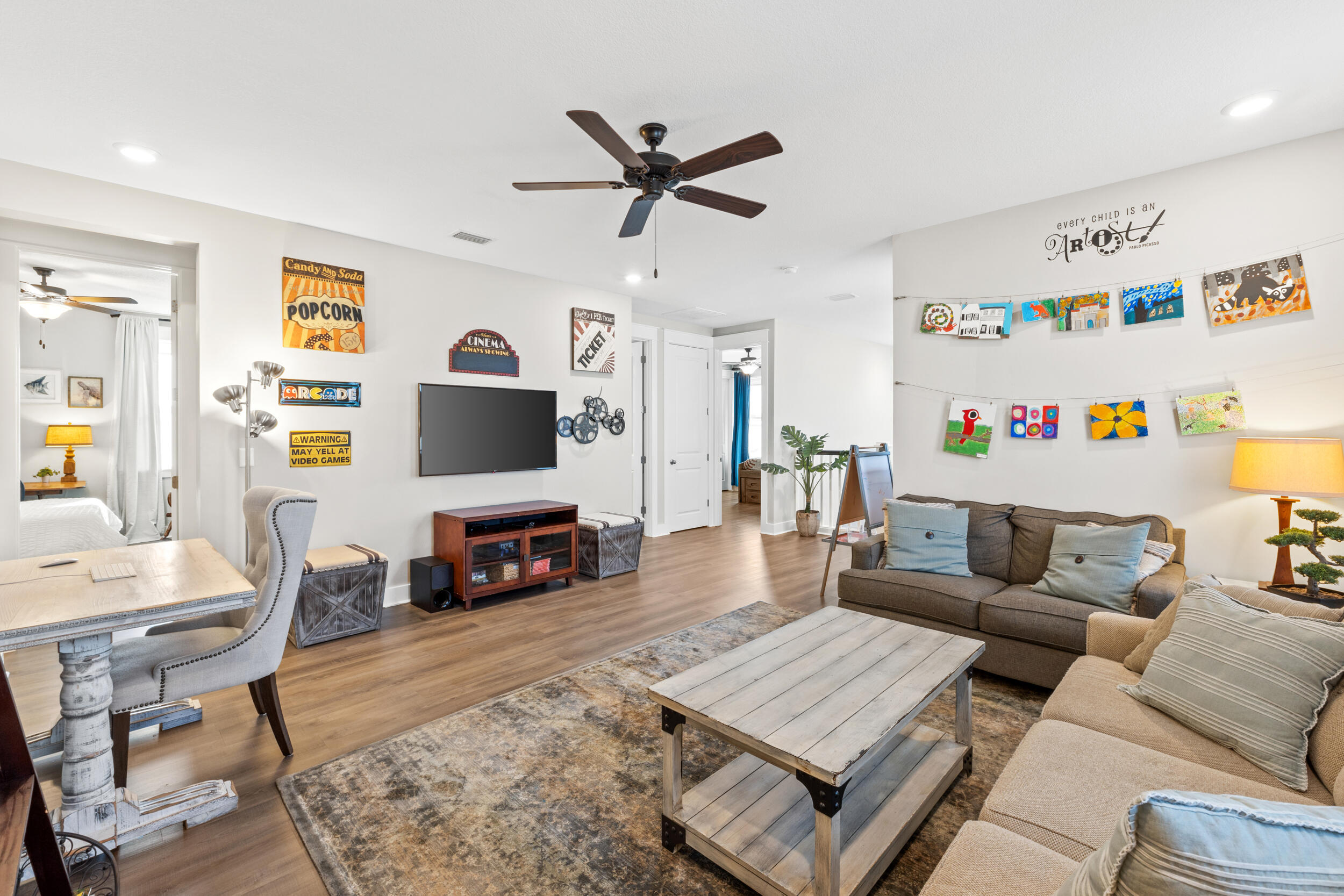 1313 North Discovery Loop Panama City, FL 32405 - Photo 31 of 50 a living room with furniture a flat screen tv and a fireplace
