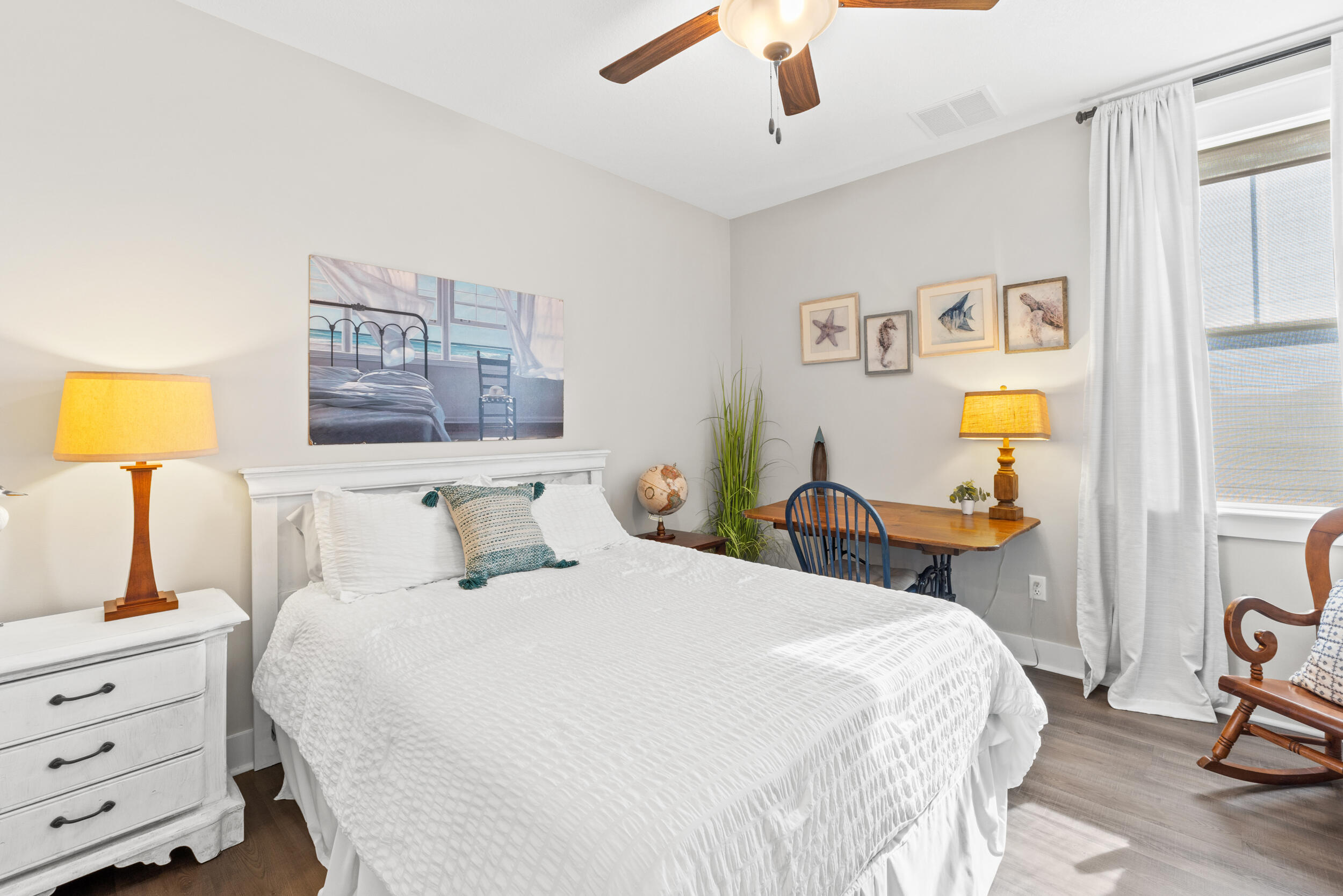 1313 North Discovery Loop Panama City, FL 32405 - Photo 32 of 50 a bedroom with a bed and a lamp on dresser