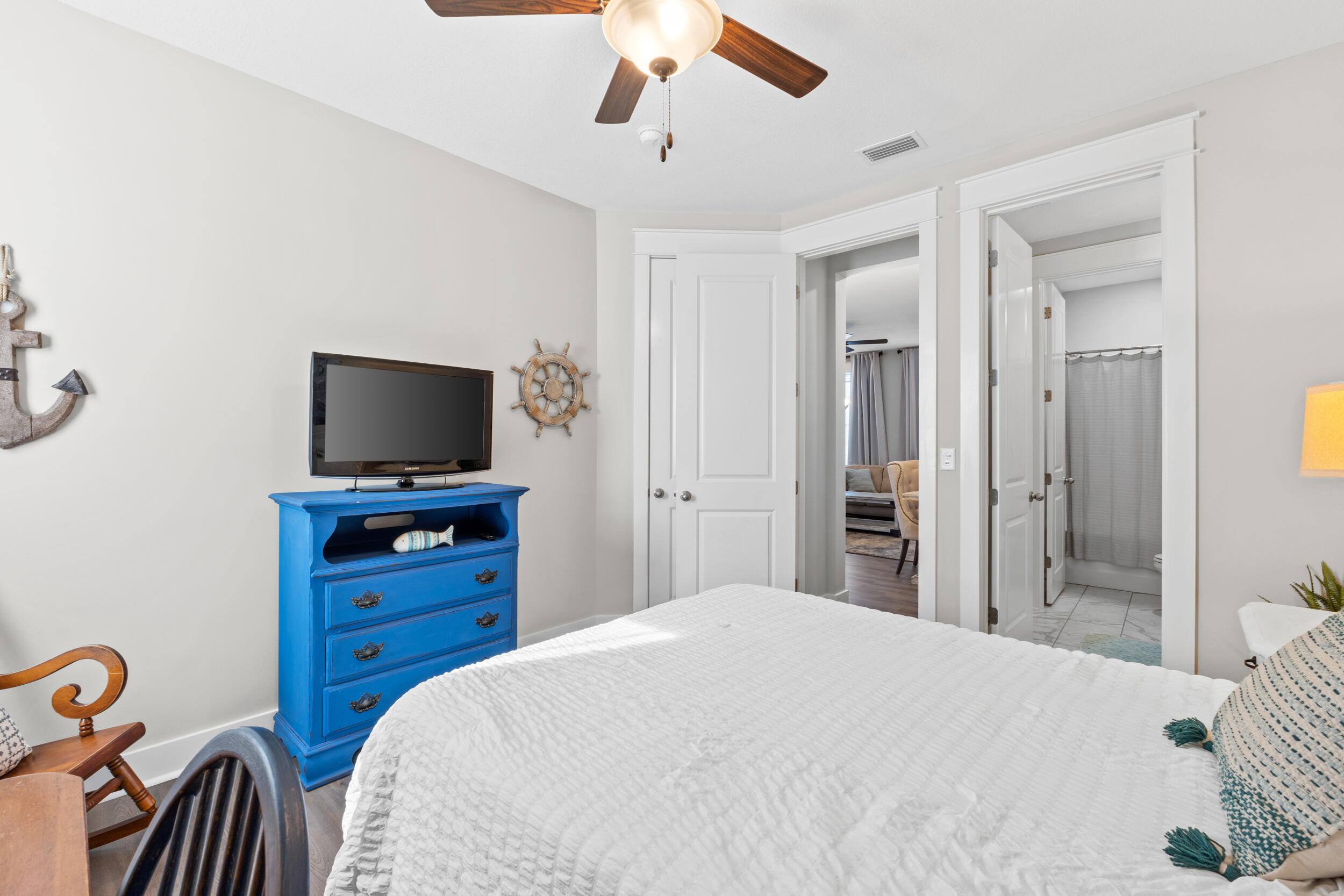 1313 North Discovery Loop Panama City, FL 32405 - Photo 34 of 50 a bedroom with a bed and a flat screen tv