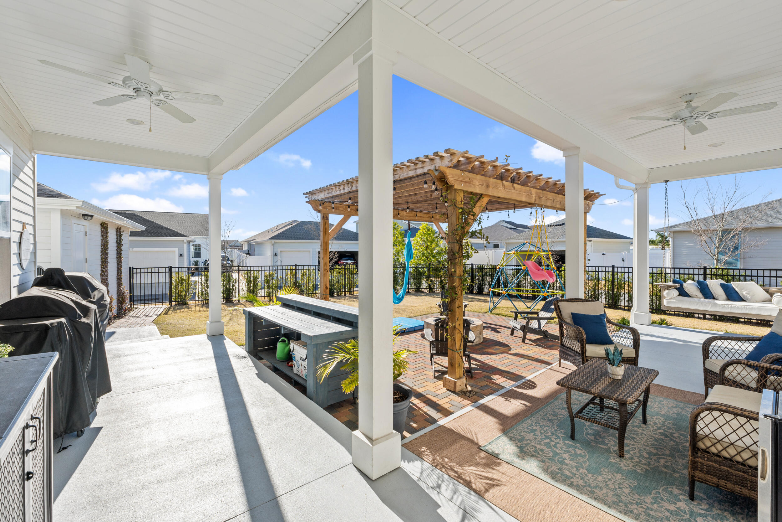 1313 North Discovery Loop Panama City, FL 32405 - Photo 38 of 50 a living room with lots of furniture and a view of dining room