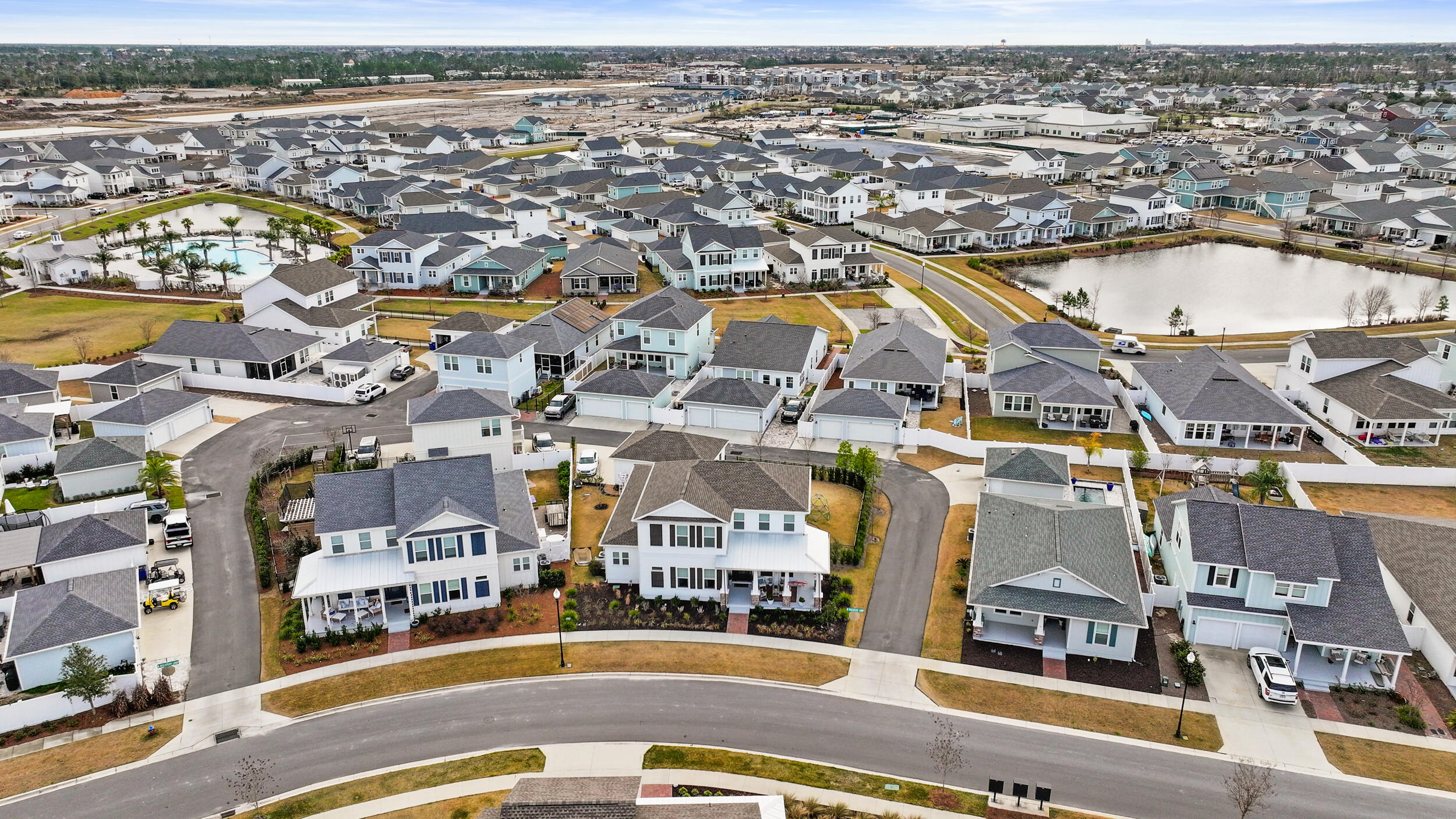1313 North Discovery Loop Panama City, FL 32405 - Photo 42 of 50 an aerial view of residential building with parking