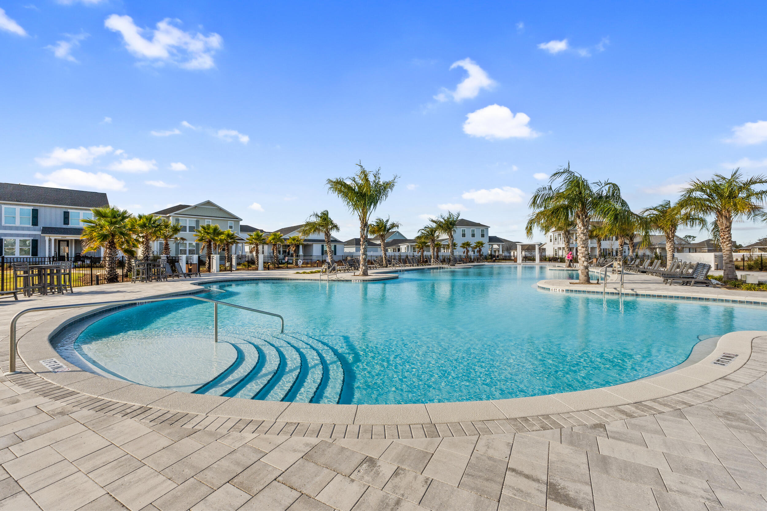 1313 North Discovery Loop Panama City, FL 32405 - Photo 44 of 50 a view of a lake with a house in the background