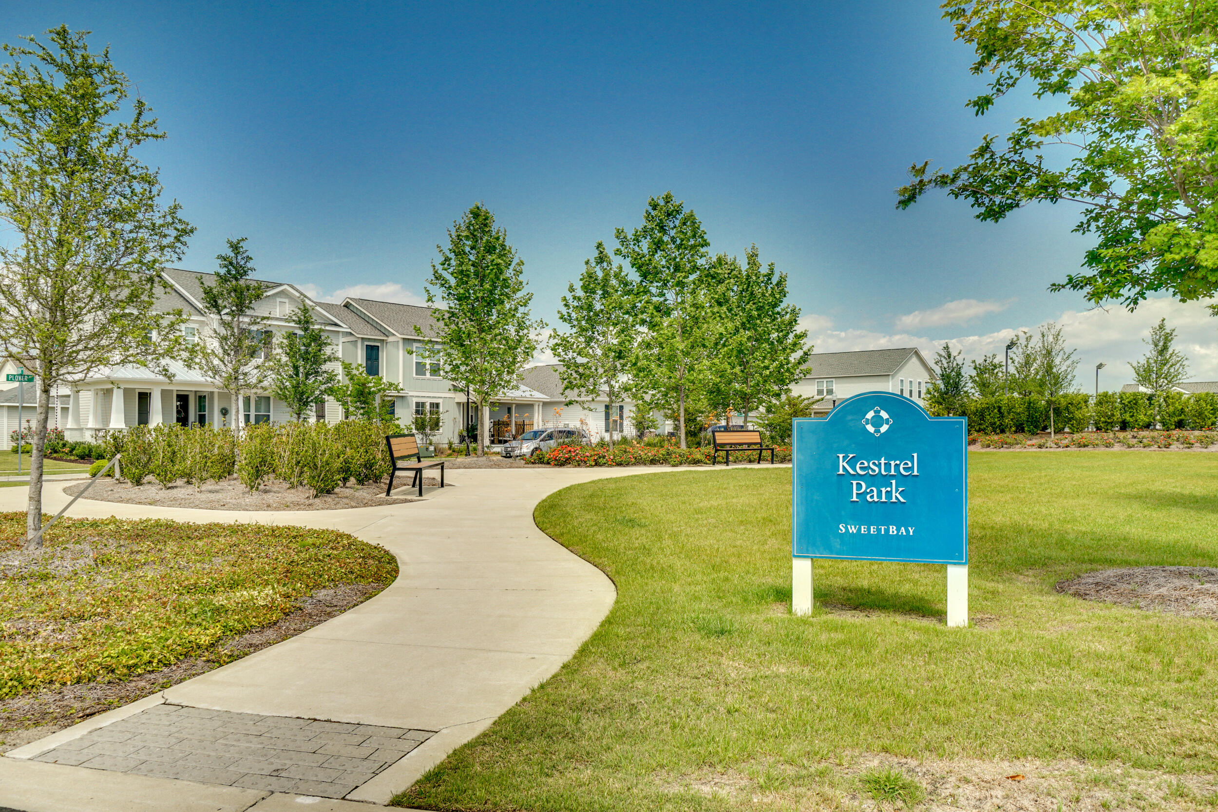 1313 North Discovery Loop Panama City, FL 32405 - Photo 49 of 50 a view of a swimming pool with a lawn chairs and a large tree